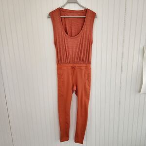 NWOT FREE PEOPLE MOVEMENT 'Off to the Races' Peach Open Back Jumpsuit size Small